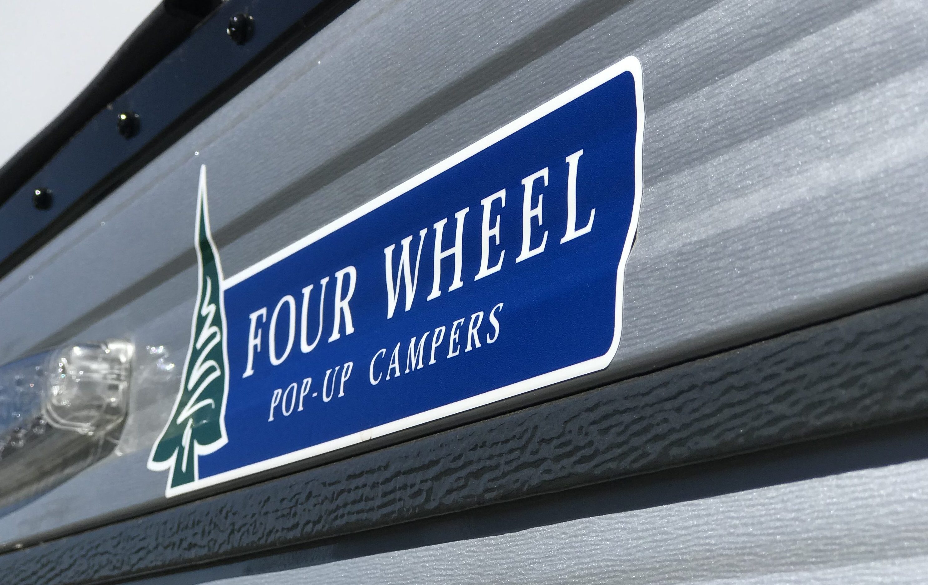 Four Wheel Campers - Four Wheel Logo Close