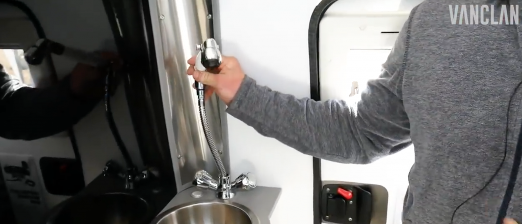 The Pull up shower as you enter the EarthCruiser is super useful and stows away incredibly neatly in the fawcett housing