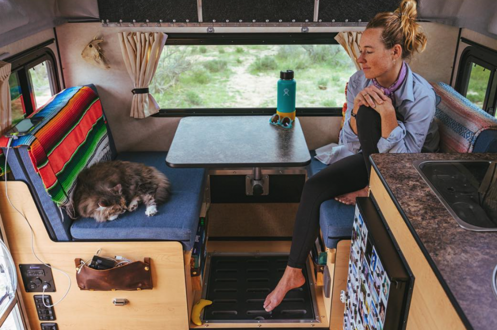 Toyota Tundra Camper office area that doubles up as a bed, shower, and cat lounge.