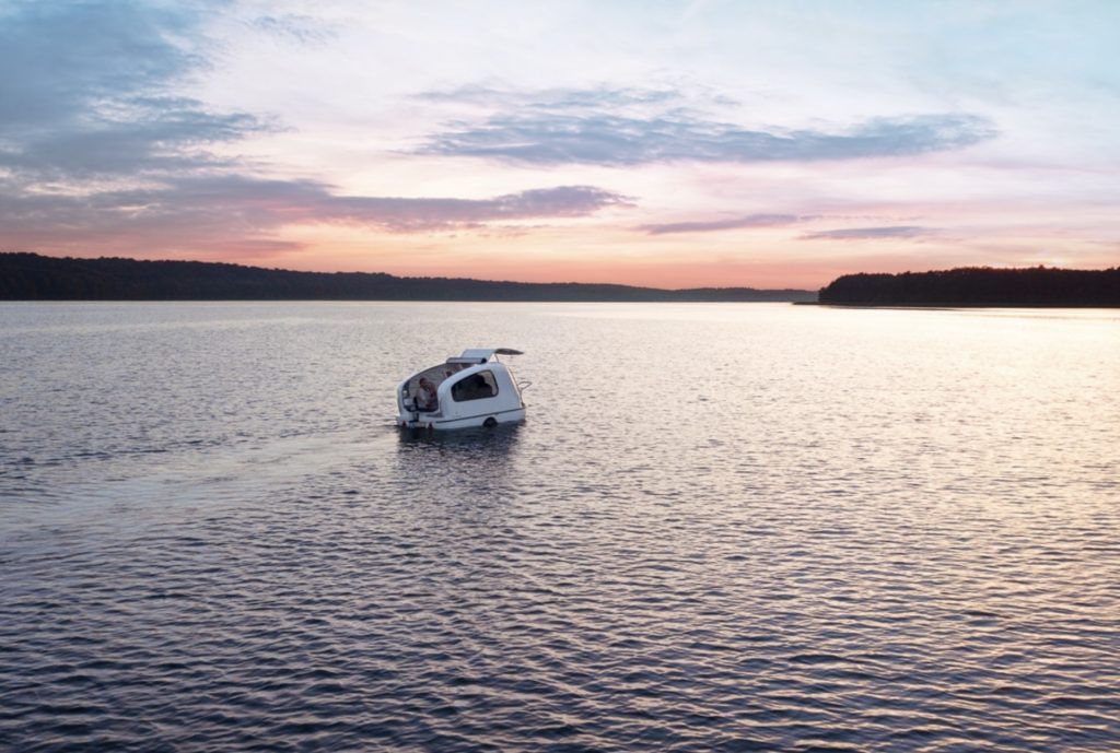 Amphibious camper - On water at sunset