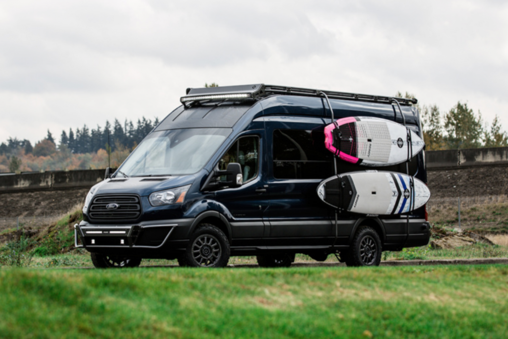 Surf andsStand up paddle board storage on the side of the van.