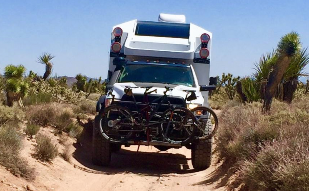 Adventure Truck cruising along a sandy track