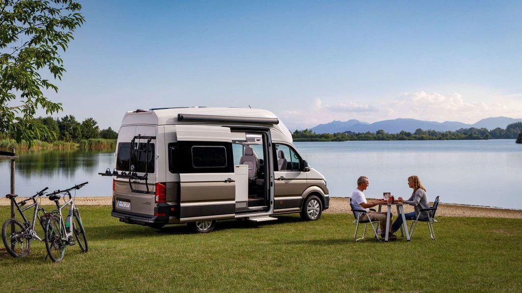 VW Grand California near a lake