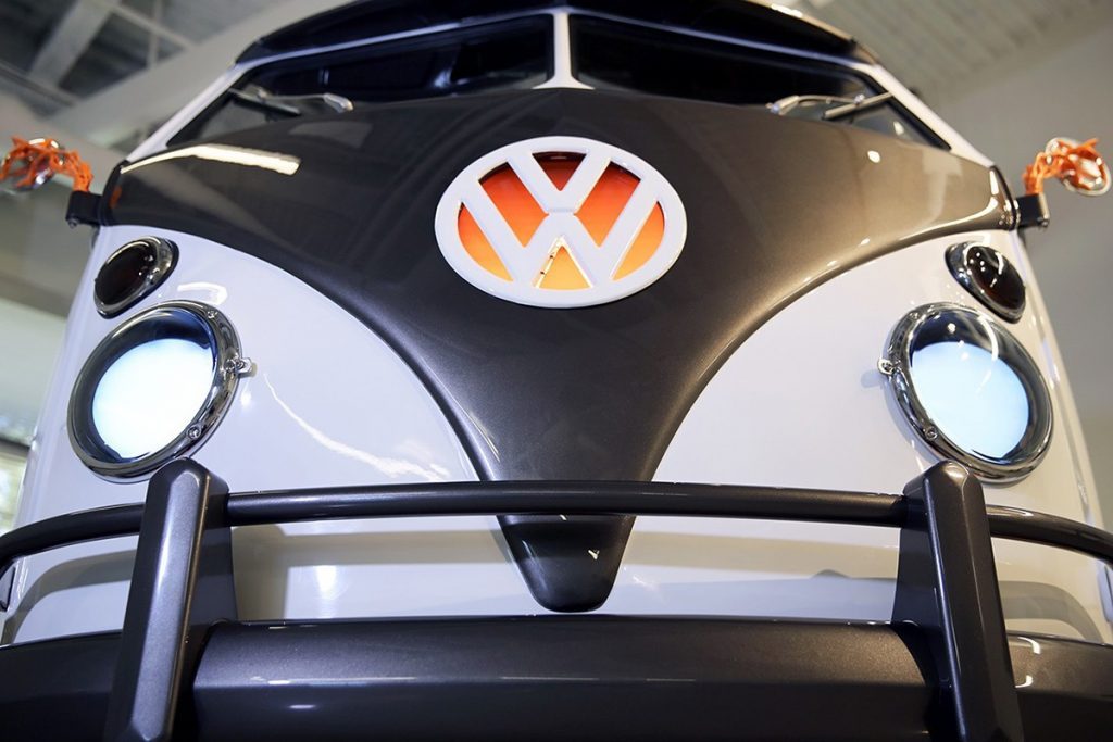 Vw Electric Campervan looks like the iron giant close up, with two white eyes as the headlamps and a black front bumper that looks so stylish!