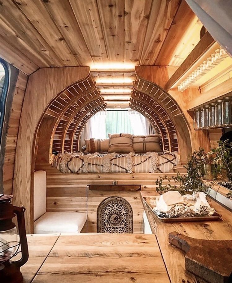 Wooden van interior with curved shelving. 