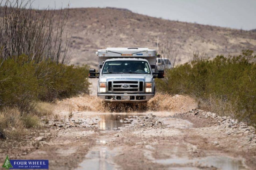 Driving a four wheel camper off road.