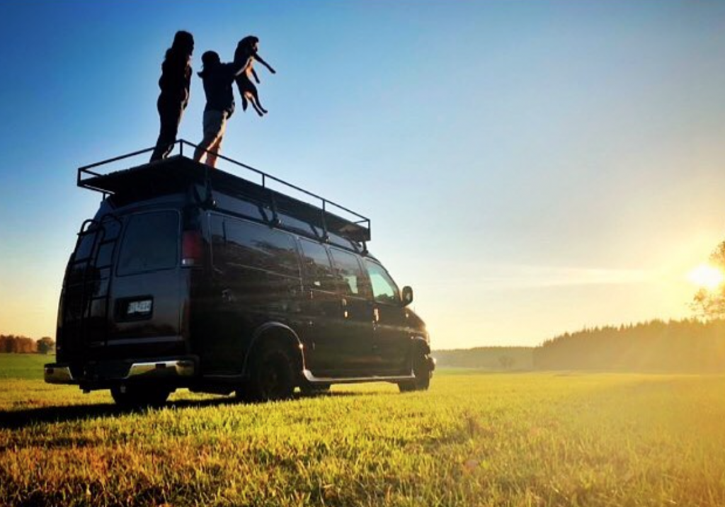 Standing on top of a van