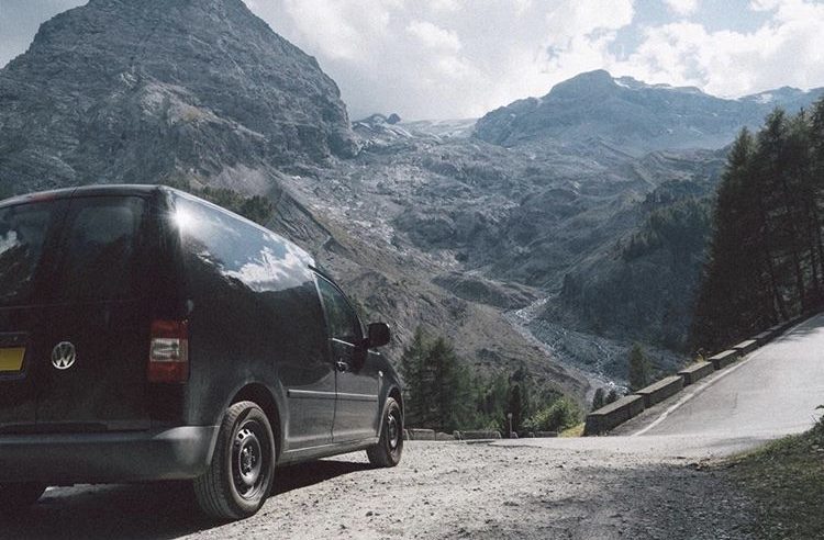 Camper on narrow mountain road.