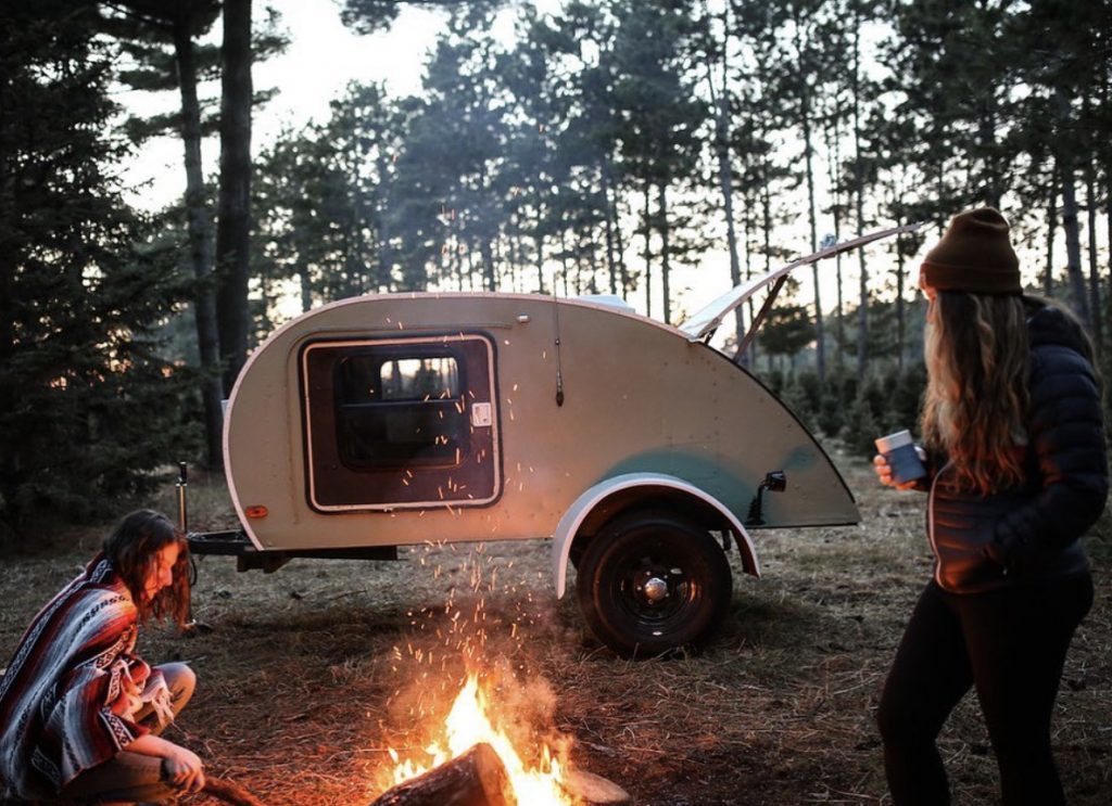 campfire infront of teardrop trailer