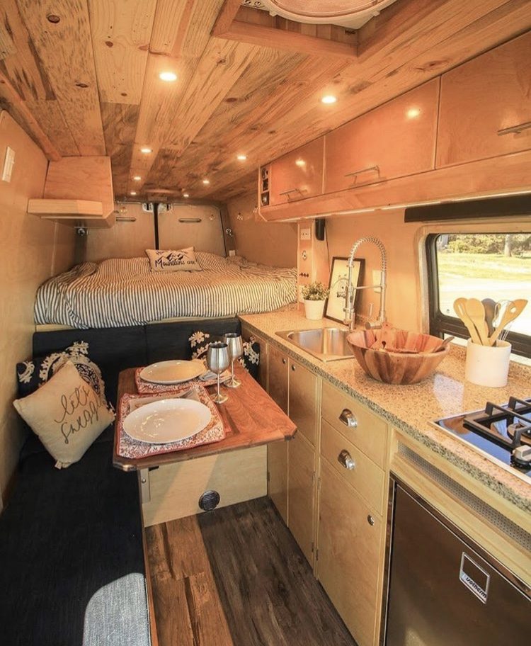 Custom Vans- dining table set insdie camper.