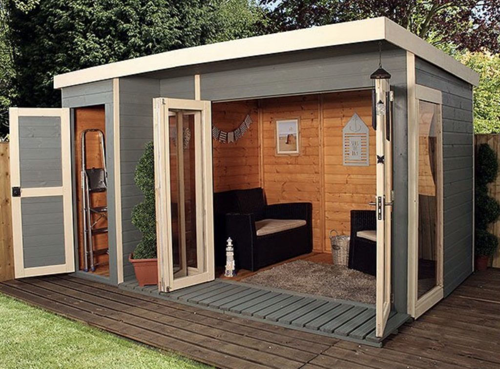 Grey shed house with frech doors.