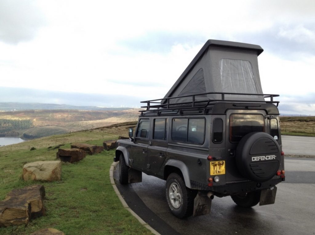 Land Rover defender with roof popped up