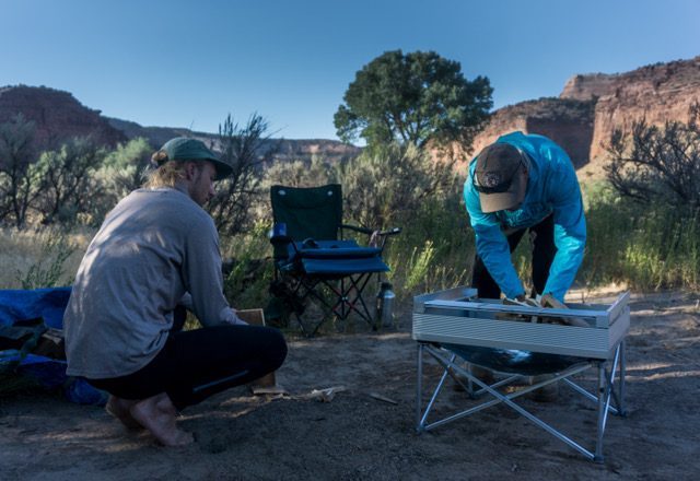 Setting up the portable fire pit on dry earth. It only takes 60 seconds to erect!