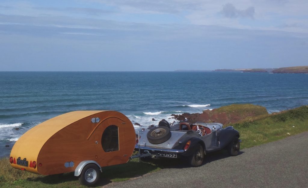 PhieldBug being towed by classic car