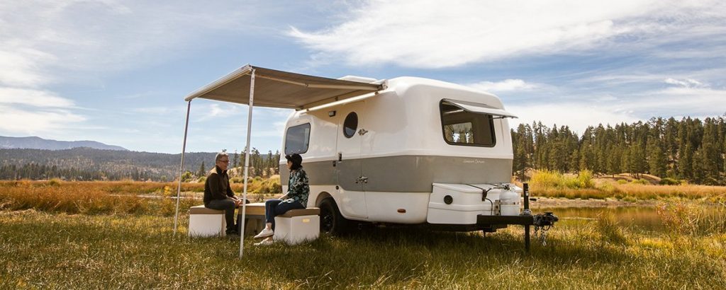 Happier Camper Traveller - couple sitting on the removable seating cubes
