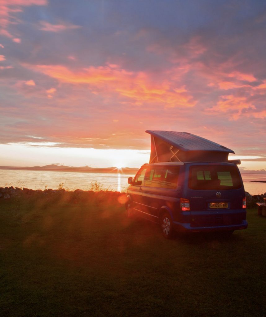 Pop top overlooking water at sunset