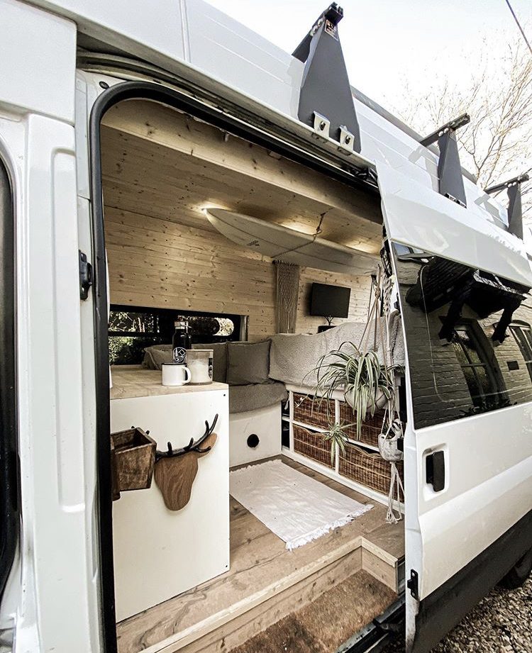 Custom van ideas - wooden interior or van with surfboard attached to ceiling inside.