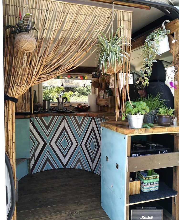 Custom van ideas- funky curved kitchen viewed through side door with blue and white diamond painted pattern on cabinetry