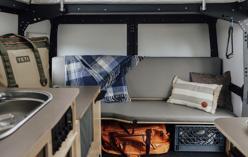 Taxa Mantis interior, grey bench seat and storage.