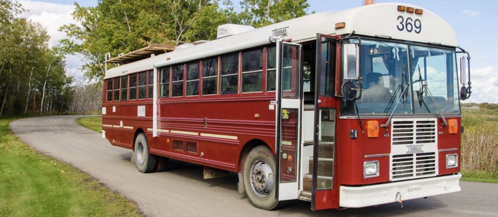 Best RVs- red exterior of The Doghouse schoolbus conversion