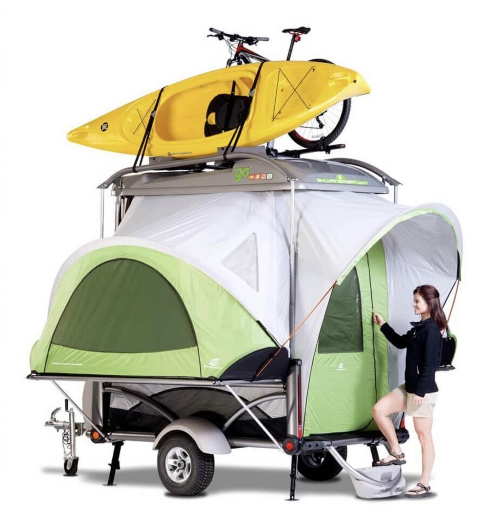 Expanded trailer tent with kayak and bike on top.