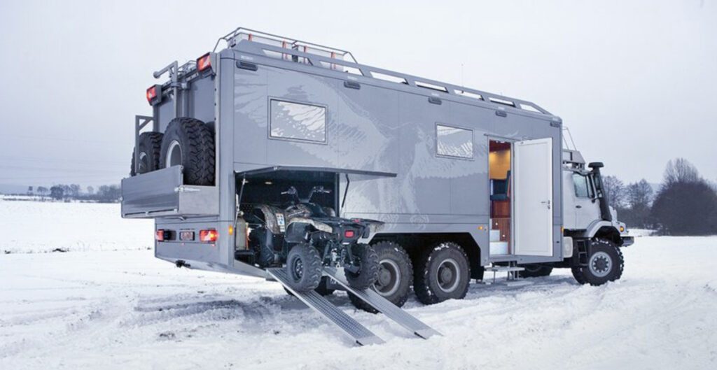 Crazy campervans - exterior of Zetros with Quadbike going in