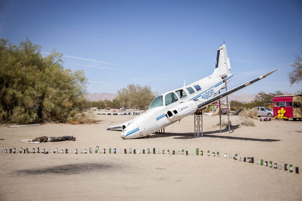 Marking out boundary lines with beer bottles