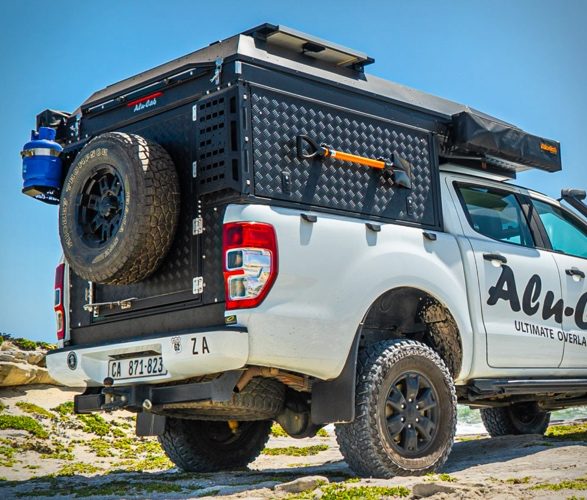 Pop Top Truck Camper - Black aluminium kick plate siding with tools