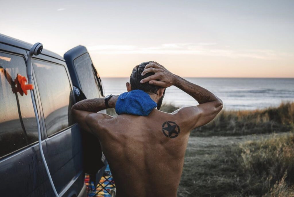 Man showering outside his van