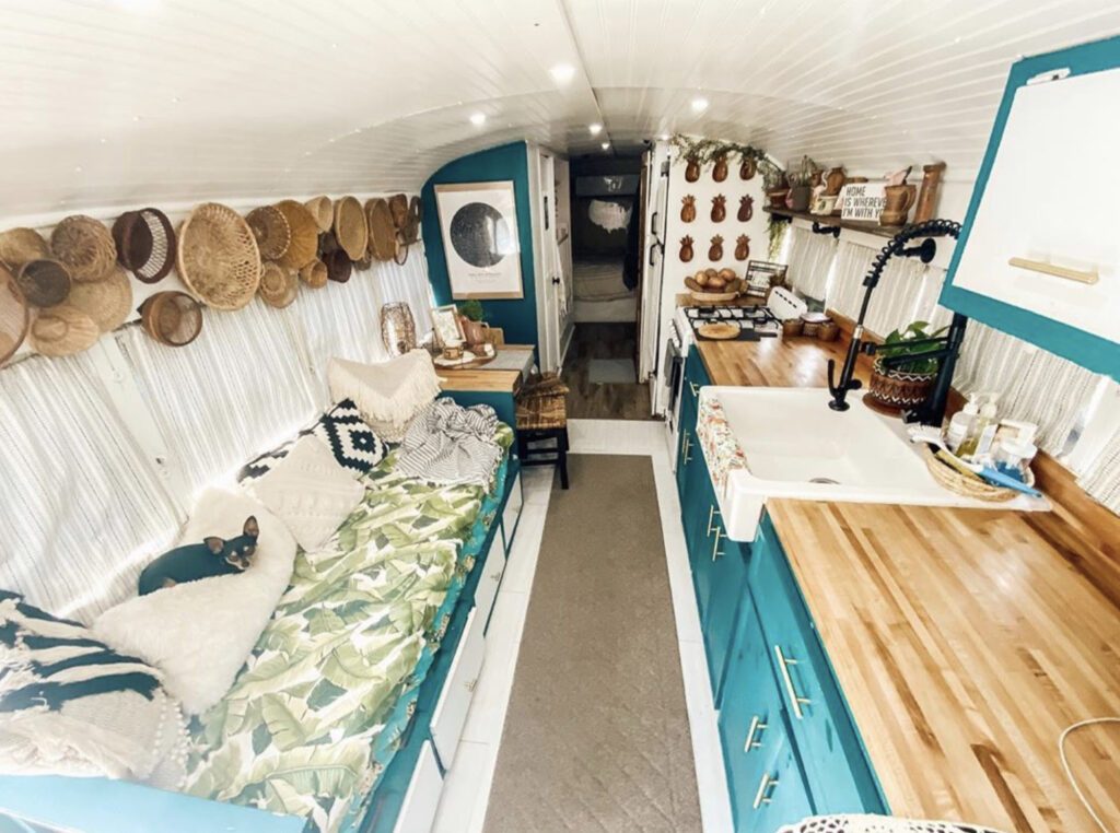 White washed wooden interior with turquoise cabinets
