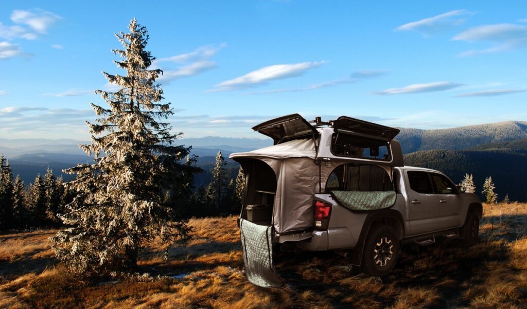 Topper EZ Lift erected near a forest glade. Top windows are open