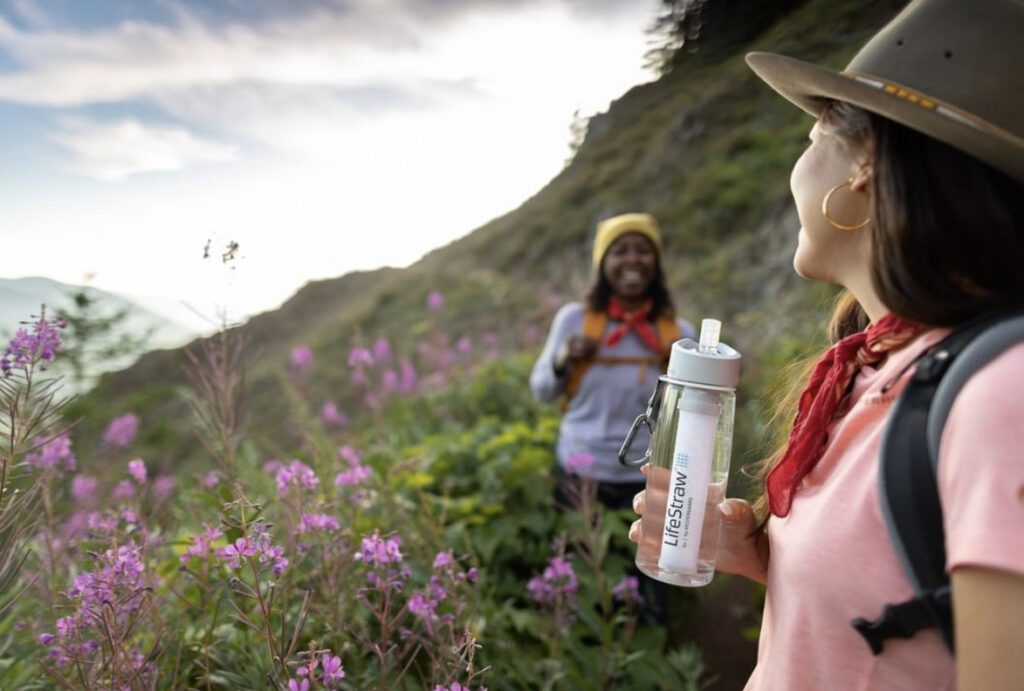 Two women drinking water