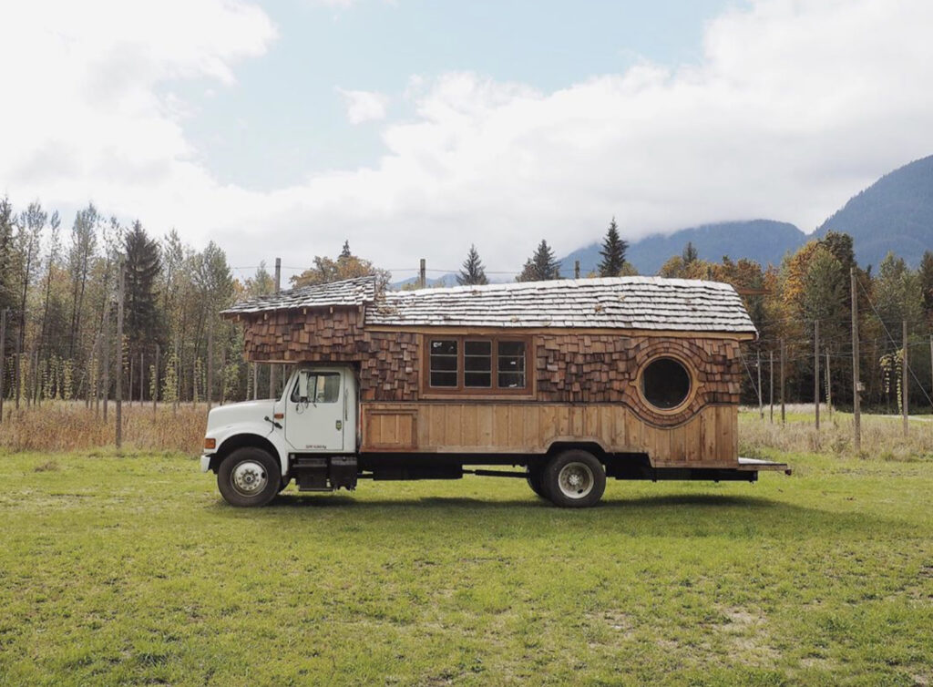 Conversion Vans - Handbuilt truck camper with wooden shingles making exterior walls