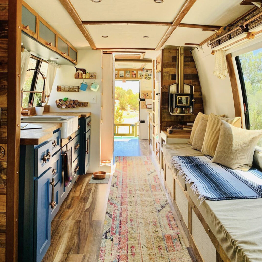 Bus conversion - blue kitchen and lots of seating space