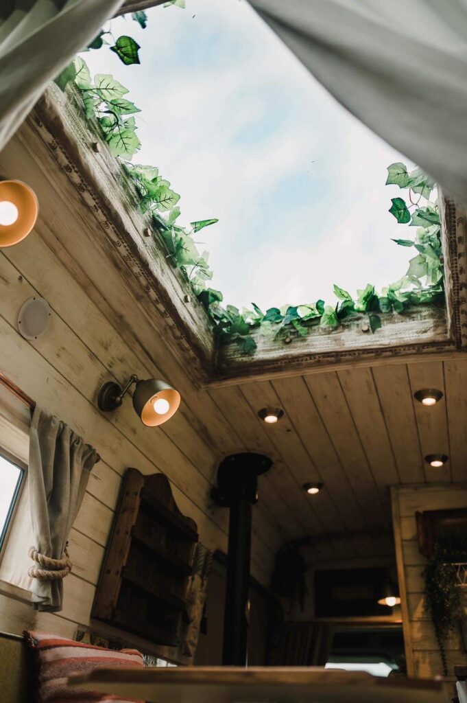 Fake plants bring nature into the space - Handcrafted Rustic Campervan