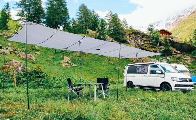 The Wildside campervan tarp is super long and provides shelter anywhere.